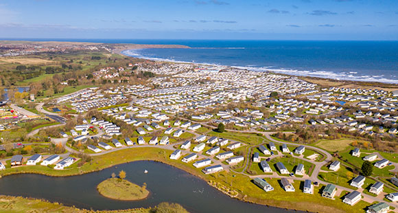 an aerial view of Primrose Holiday Park with the Yorkshire coast in the horizon