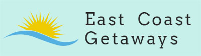 the logo for East Coast Getaways - a sun disappearing behind a wave with the company name to the right